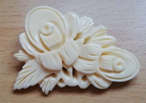 Vintage bone brooch with thistle flower design