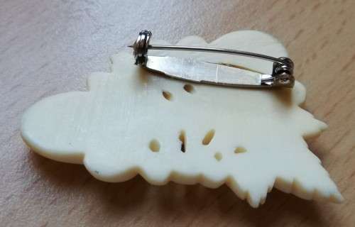 Vintage bone brooch with thistle flower design