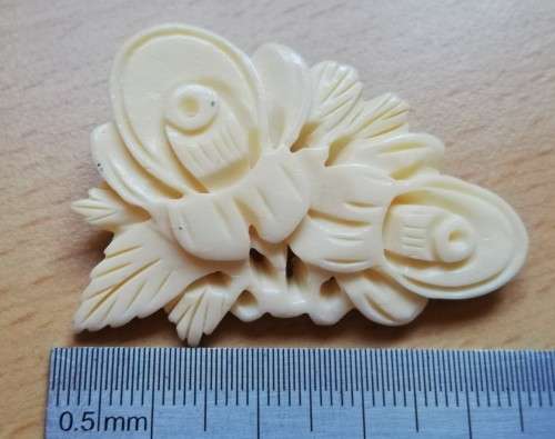 Vintage bone brooch with thistle flower design