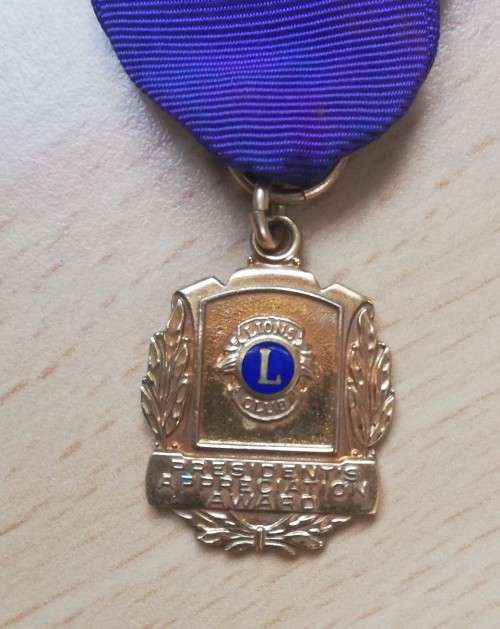 Pair of small 10ct gold-filled Lions Club awards