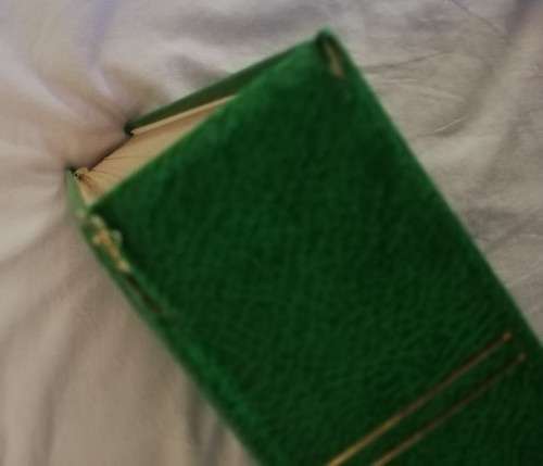 Stamp album, slightly damaged, 32 pages