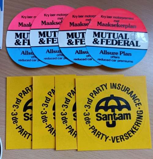 Vintage lot of 11 SA insurance car disk stickers - see description for details