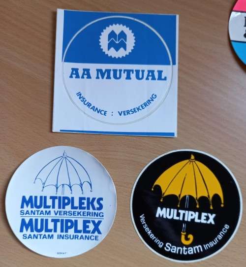 Vintage lot of 11 SA insurance car disk stickers - see description for details