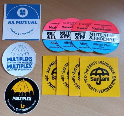 Vintage lot of 11 SA insurance car disk stickers - see description for details
