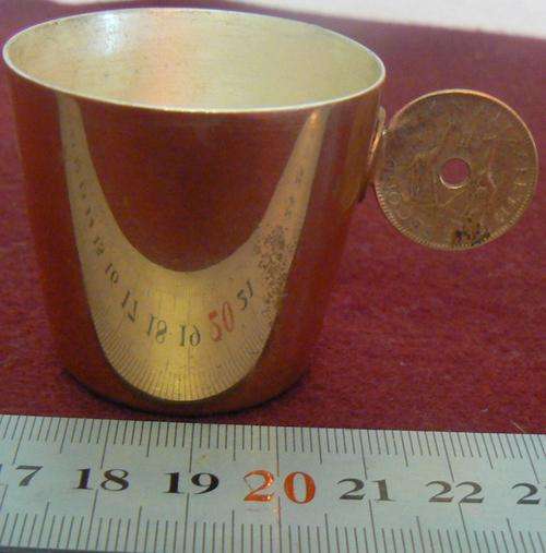 Rhodesia copper tot measure with Rhodesia & Nyasaland 1957 half penny as handle