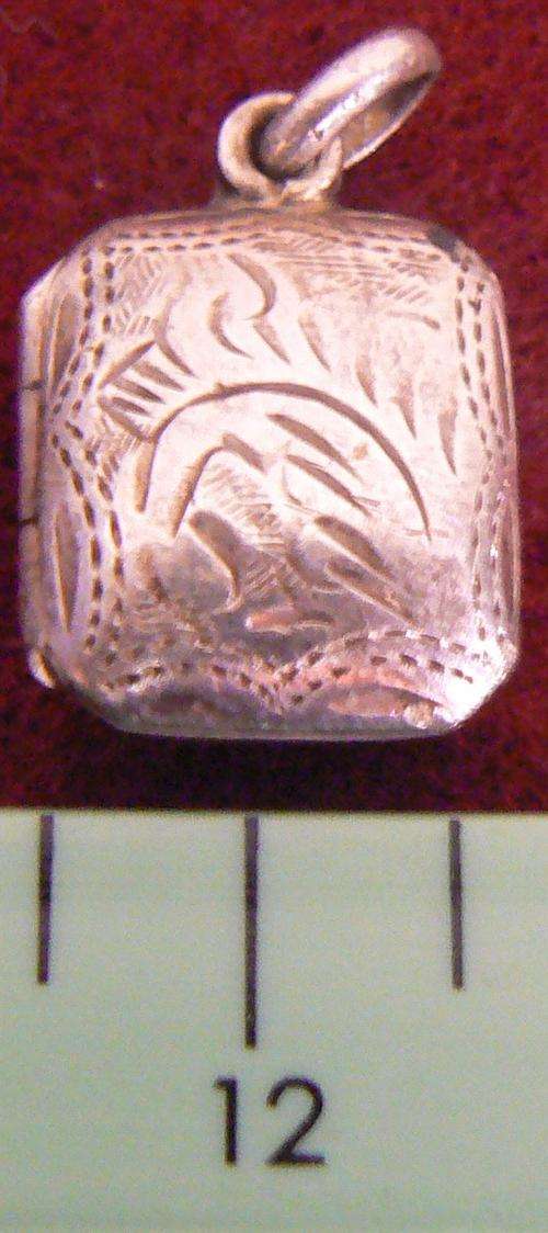Small silver locket, square shape.