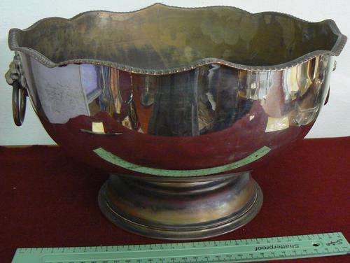 Large silver on copper rose bowl with two lion handles