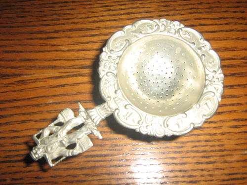 Silver tea stainer and holder