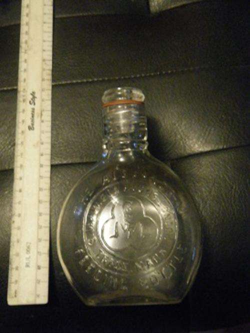 The glass-molded Alexandra "Banjo" baby bottle  shown here-very rare-bid now