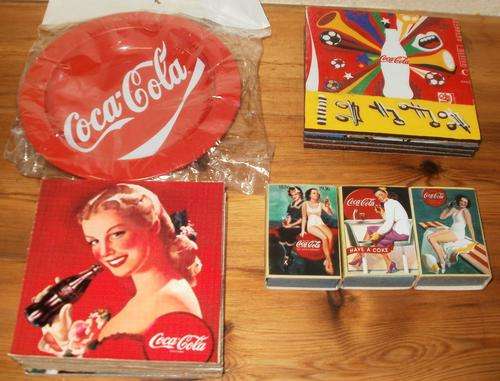 Coca Cola ashtray, two different sets of coasters and hand made match boxes