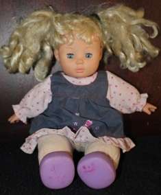 Lovely blond haired doll with blue eyes - +/- 30cm