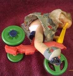 Doll on a Tricycle