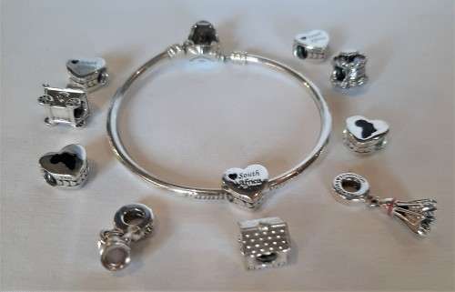 Beautiful Authentic Sterling silver PANDORA Bracelet 10 x starter charms VALUE over R6000 R1 NR