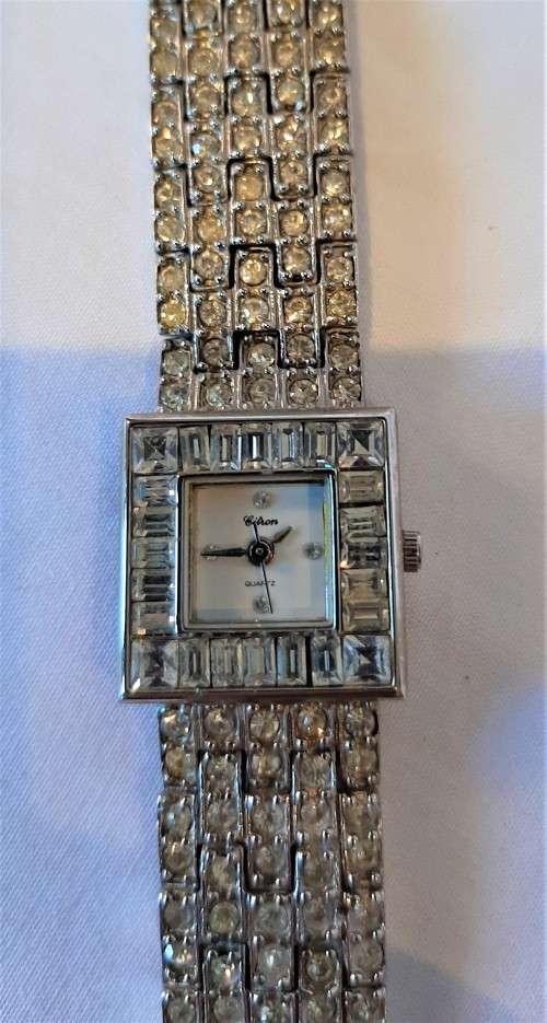 18k white gold plated ladies watch, quartz movement, strap and bezel encrusted Rhinestones NW