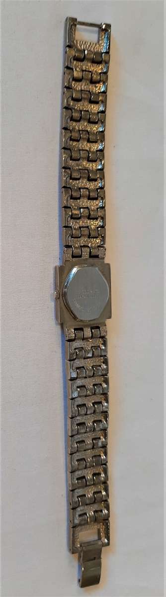 18k white gold plated ladies watch, quartz movement, strap and bezel encrusted Rhinestones NW