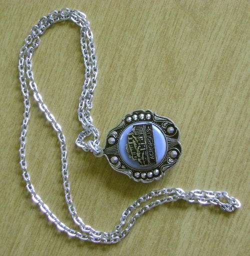 Double-sided souvenir pendant from Greece