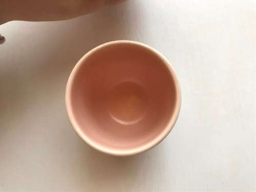 Poole pottery twin tone four-egg cup breakfast set with stand