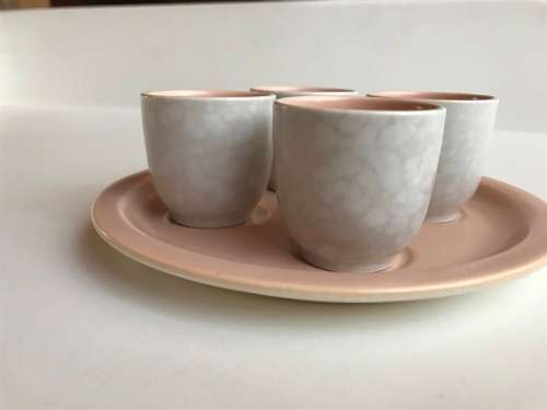 Poole pottery twin tone four-egg cup breakfast set with stand