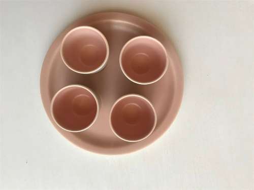 Poole pottery twin tone four-egg cup breakfast set with stand