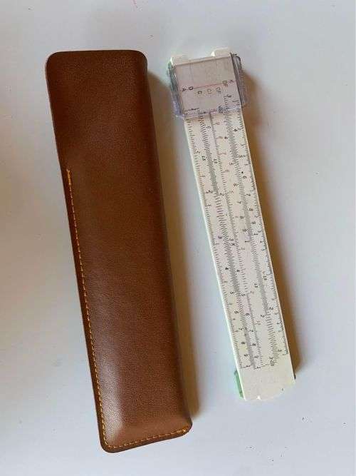 Hemmi slide rule in its own leather pouch
