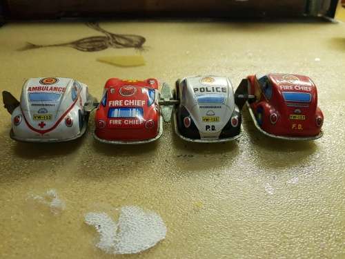 4x Vintage clockwork tin plate cars (80mm)