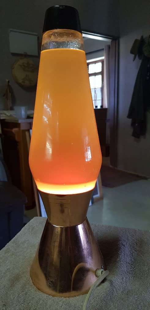 Vintage lave lamp with brass base.. Globe works