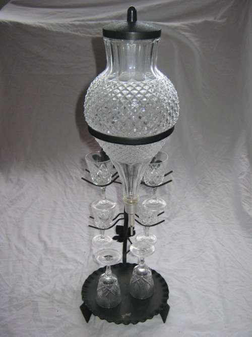 GLASS DECANTER ON BLACK METAL STAND & GLASSES