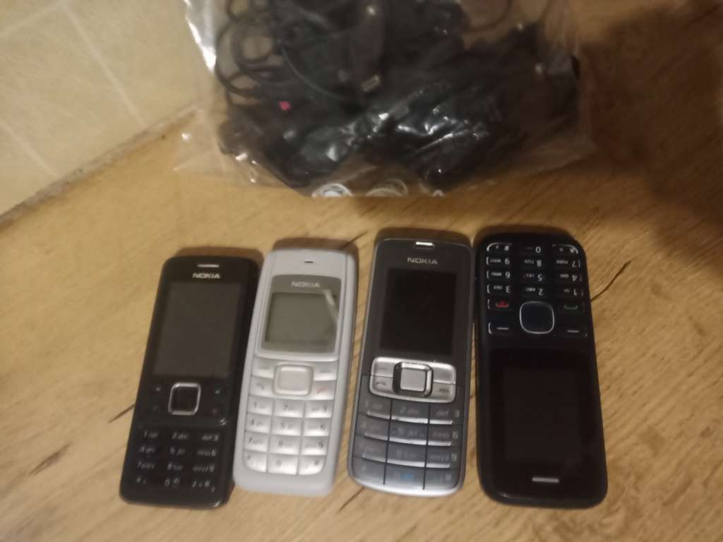Four old cellphones unknown condition