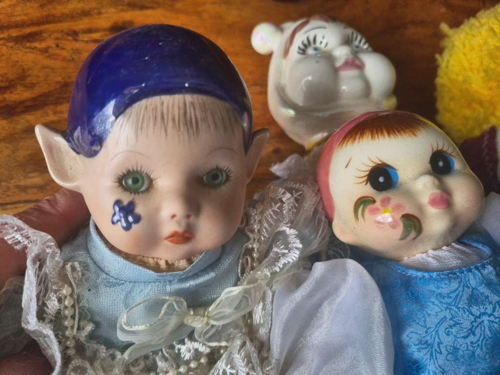One bid for the Family  four vintage porcelain dolls