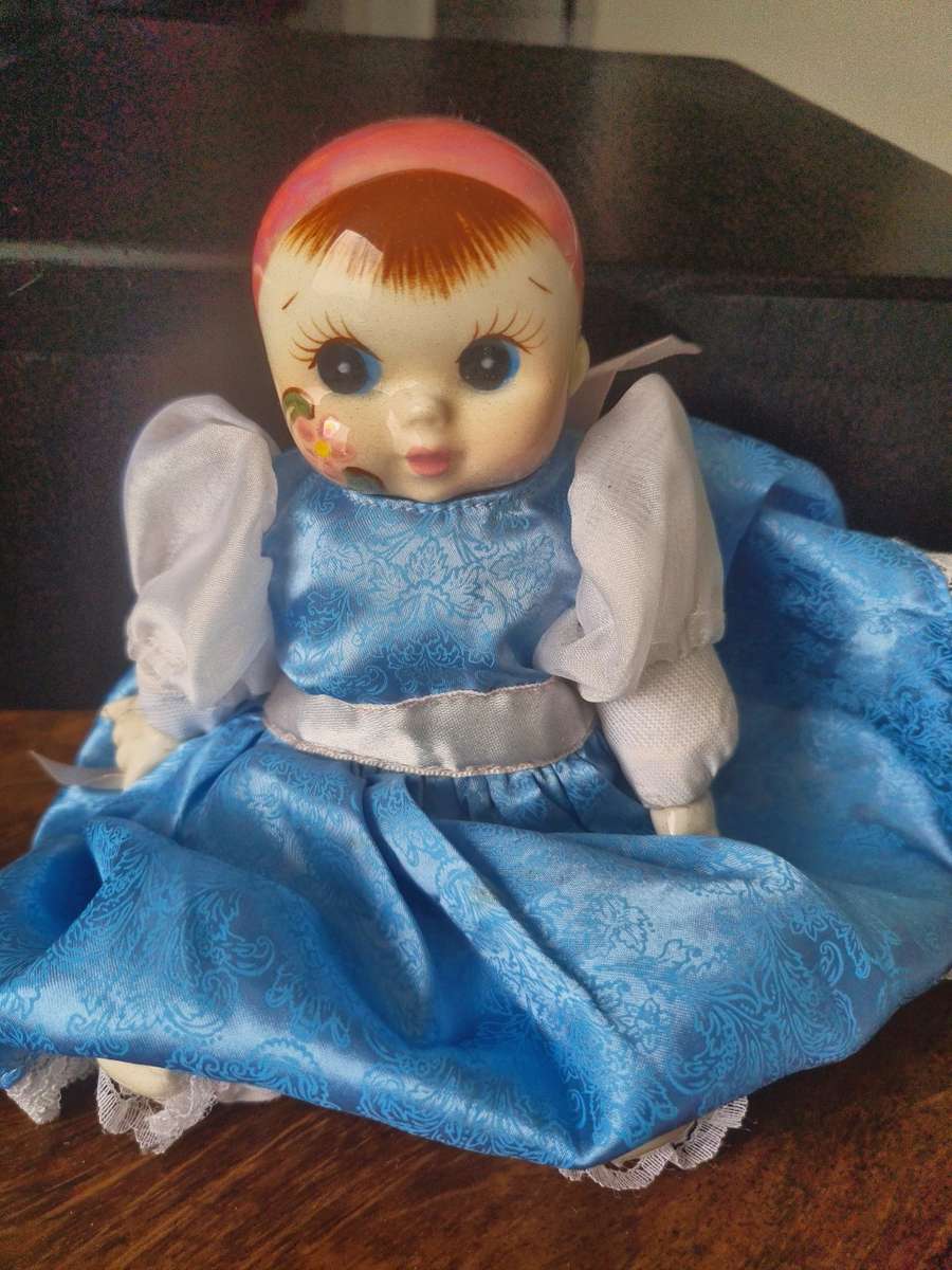 One bid for the Family  four vintage porcelain dolls