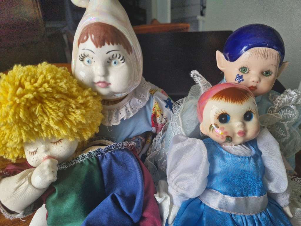 One bid for the Family  four vintage porcelain dolls