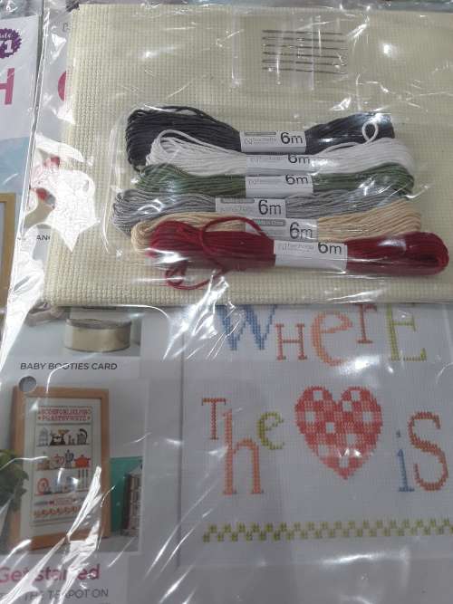 8 ISSUES OF CROSS STITCH PATTERNS(INCL.CANVAS,NEEDLES,COTTONS,BINDER, ETC...)ONE BID