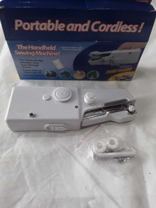 HANDHELD SEWING MACHINE WITH FREE BOBBINS