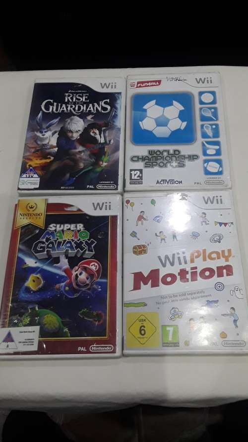 NINTENDO WII WITH REMOTE AND FOUR GAME DISC(NO CABLES)