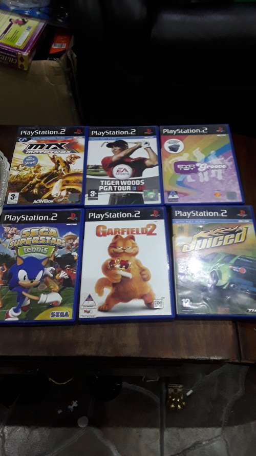 SONY PLAYSTATION 2 WITH 1 CONTROL,POWER SUPPLY AND 6 GAME DISCS