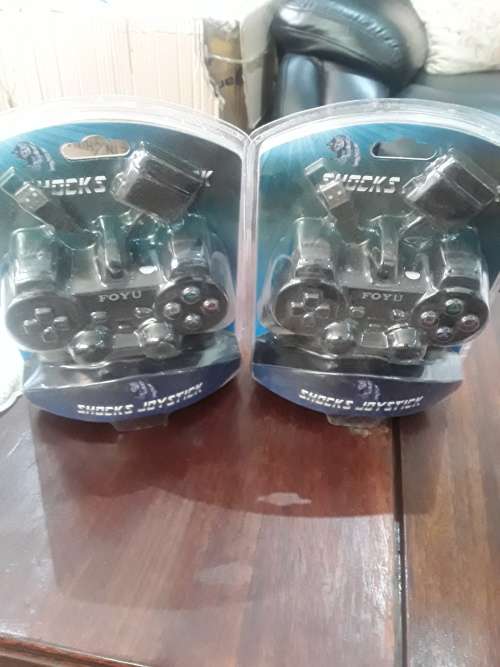 SONY PS11 CONSOLE WITH 2 CONTROLS,POWER SUPPLY AND 9 ORIGINAL GAME DISCS