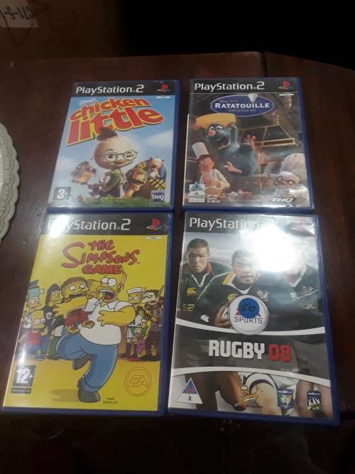 SONY PS11 CONSOLE WITH 2 CONTROLS,POWER SUPPLY AND 9 ORIGINAL GAME DISCS