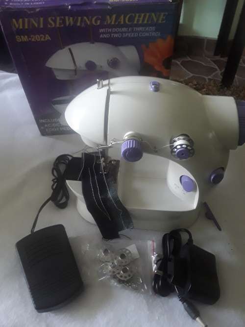 DOUBLE SPEED CONTROL MINI SEWING MACHINE (FREE ASSESCORIES)