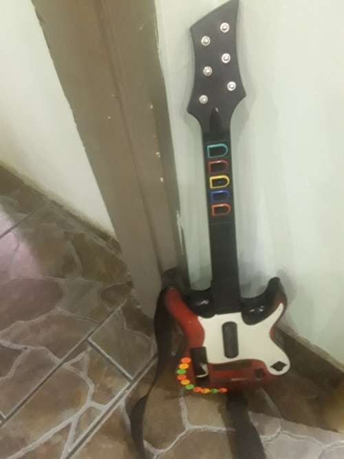 NINTENDO WII CONSOLE WITH 8 GAME DISCS,DRUM,GUITAR,MICROPHONE, DANCE BOARD and ASSESCORIES