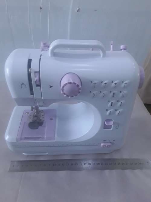 ELECTRONIC TWELVE STITCH SEWING MACHINE