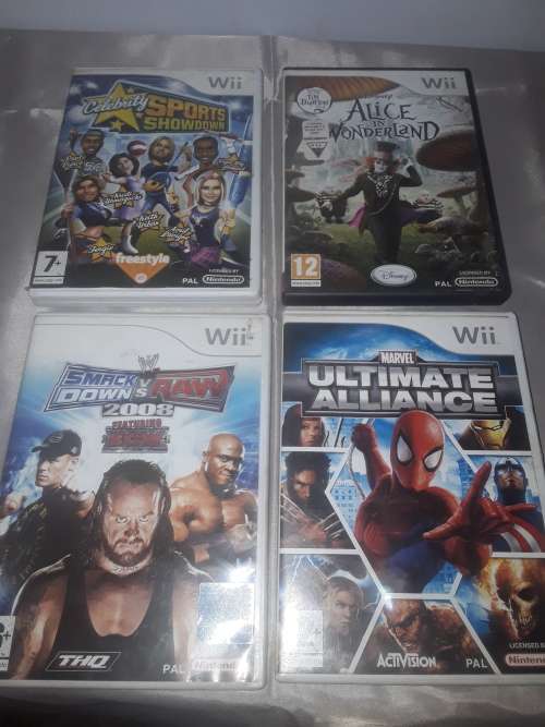 NINTENDO WII CONSOLE INCLUDING P.SUPPLY ,4 GAME DISCS AND ASSESCORIES