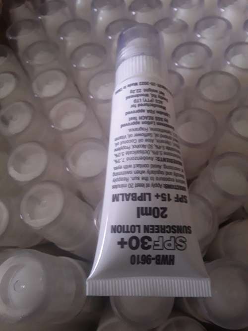 150 PIECES IN A BOX 2 IN ONE SPF 30 SUNSCREEN LOTION AND LIP BALM (20ML EACH)