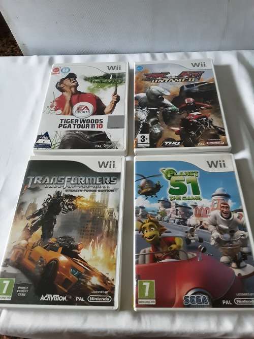 NINTENDO WII CONSOLE INCL.2 REMOTES, ADAPTERS,POWER SUPPLY,7 GAME DISCS AND ALL ASSESCORIES AS PHOTO