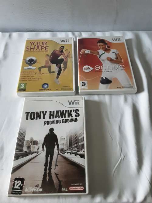 NINTENDO WII CONSOLE INCL.2 REMOTES, ADAPTERS,POWER SUPPLY,7 GAME DISCS AND ALL ASSESCORIES AS PHOTO