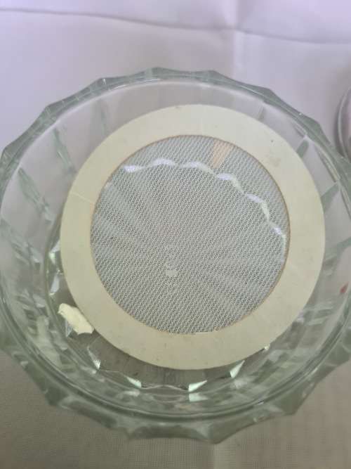 VINTAGE GLASS POWDER JAR WITH ORNATE FLORAL CHERUB/ANGEL MIRROR LID