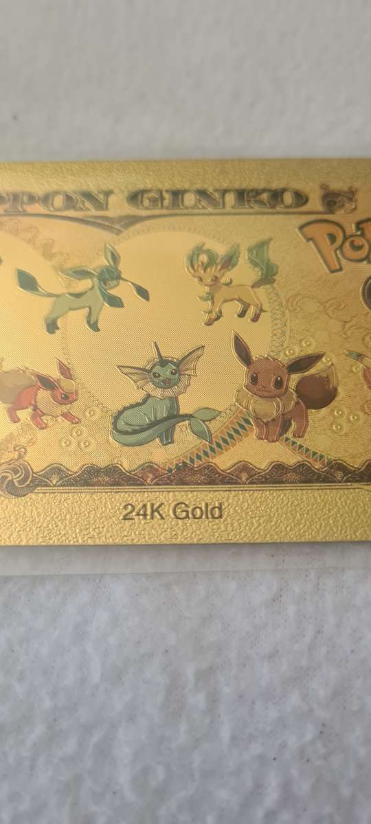 24 K GOLD POKEMON NOTE AND A POKEMON COIN