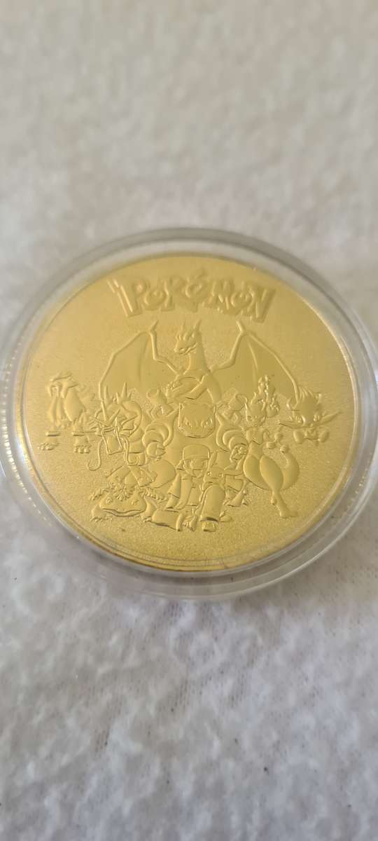24 K GOLD POKEMON NOTE AND A POKEMON COIN