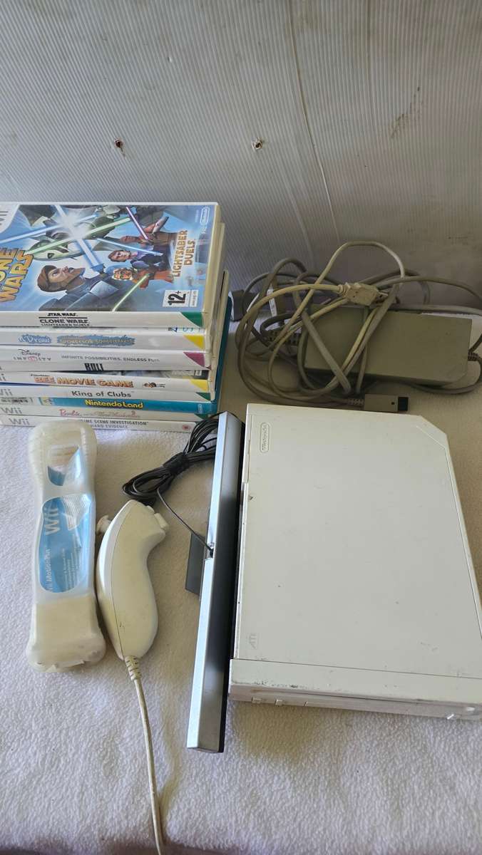 NINTENDO WII CONSOLE INCL.POWER SUPPLY,9 GAME DISC AND ALL ASSESCORIES AS PER PHOTOS