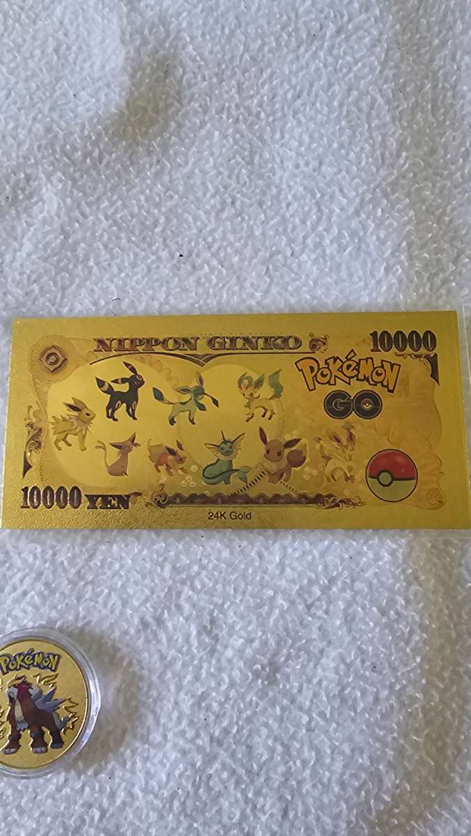 24K GOLD POKEMAN NOTE AND A POKEMAN COIN