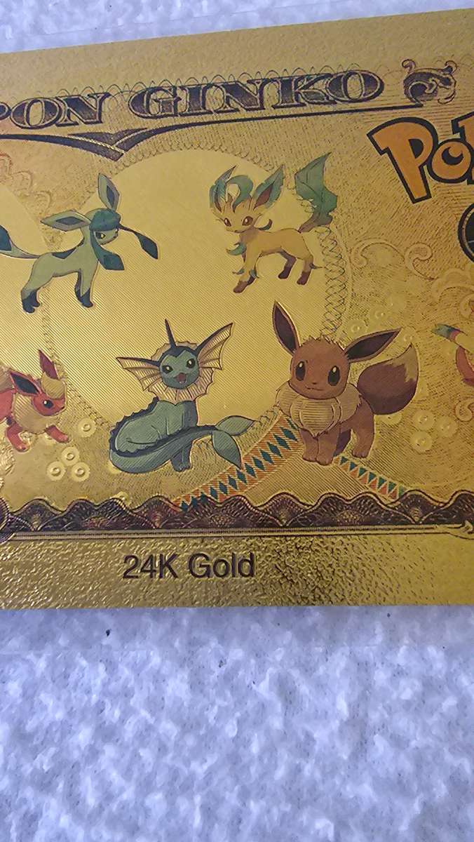 24K GOLD POKEMAN NOTE AND A POKEMAN COIN